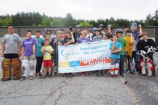 ball hockey players at team “Timeless Memories'” ball hockey tournament fundraiser for the 2013 Relay for Life at the Frontenac Community Arena on May 19